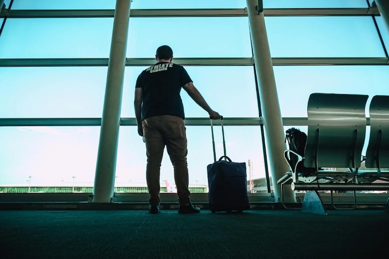 man-holding-luggage-bag.jpg